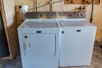 Available washer and dryer in laundry room.
